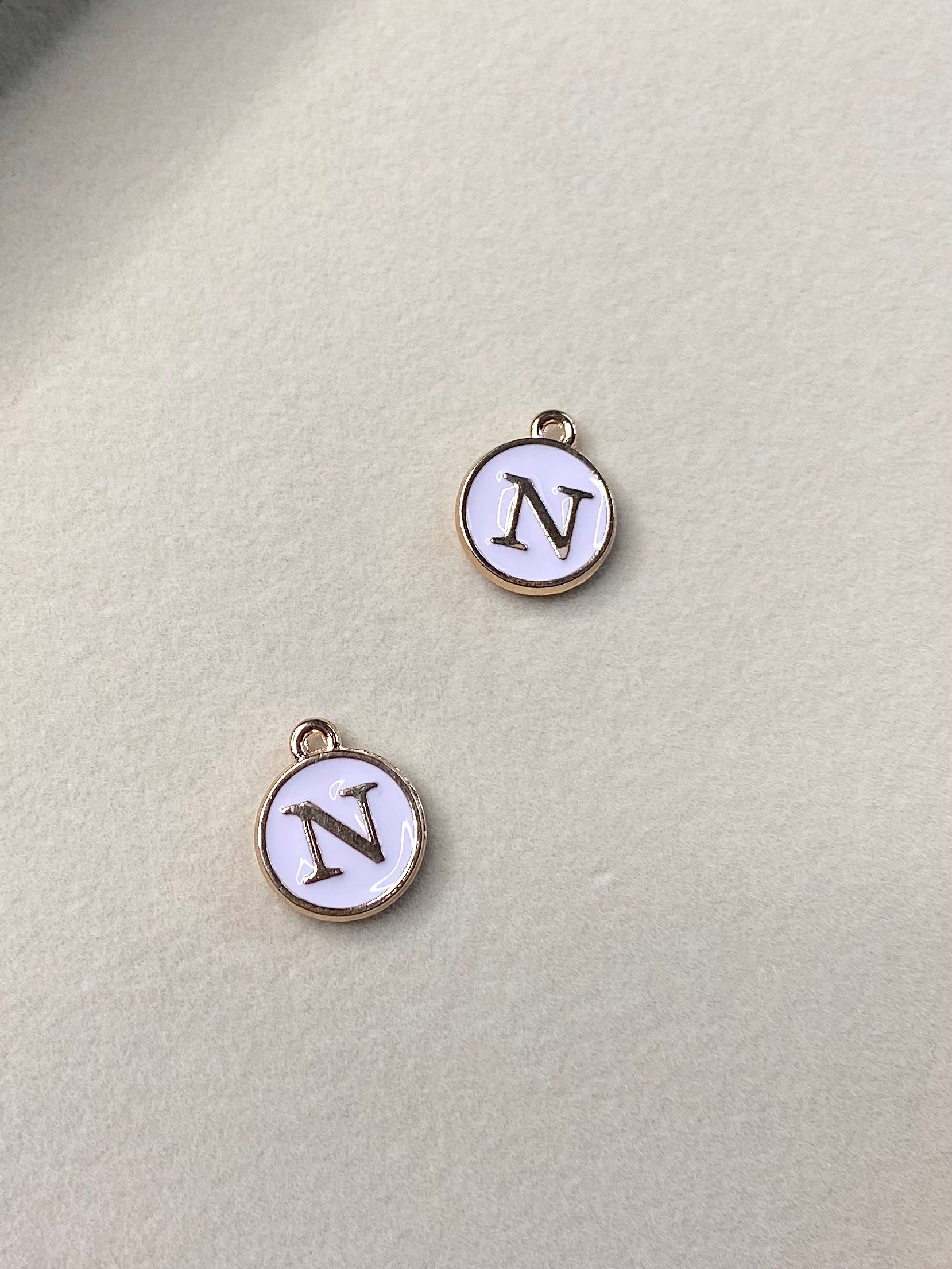 White Circle Letter N Charm