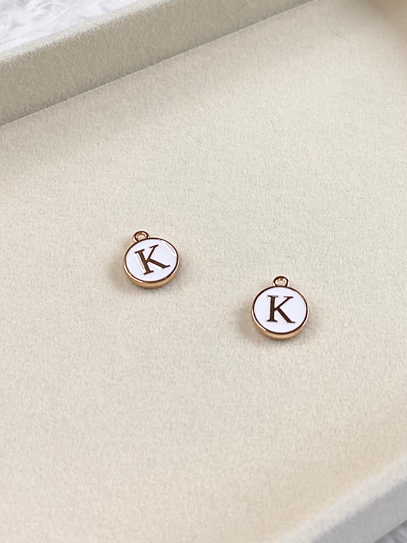 White Circle Letter “K” Charm